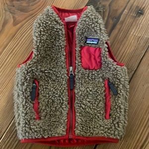 Gently used Patagonia vest size 6-12mo. Red/Tan, runs large